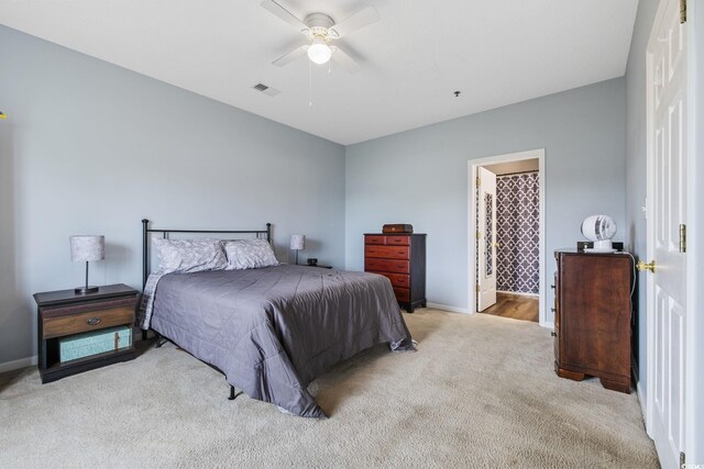 2090 Cross Gate Blvd Unit 202, Surfside Beach, SC 29575 - bedroom featuring carpet flooring, baseboards, a ceiling fan, and connected bathroom