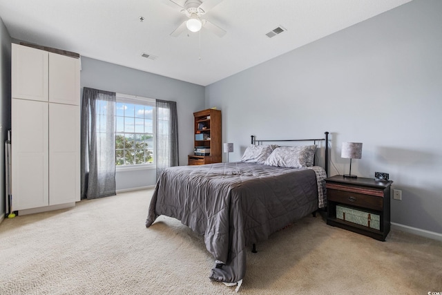 2090 Cross Gate Blvd Unit 202, Surfside Beach, SC 29575 - bedroom with light colored carpet, baseboards, and ceiling fan