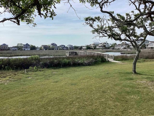 409 Salt Marsh Cir Unit 20C, Pawleys Island, SC 29585 - view of yard featuring a residential view and a water view