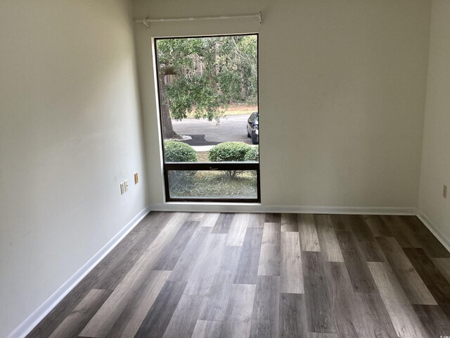 409 Salt Marsh Cir Unit 20C, Pawleys Island, SC 29585 - empty room with wood finished floors and baseboards