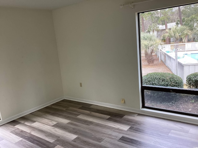 409 Salt Marsh Cir Unit 20C, Pawleys Island, SC 29585 - empty room featuring baseboards and wood finished floors