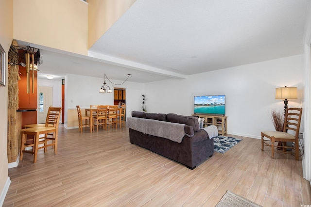 living room featuring light wood-style floors and baseboards