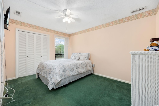 bedroom featuring carpet floors, baseboards, a textured ceiling, and visible vents