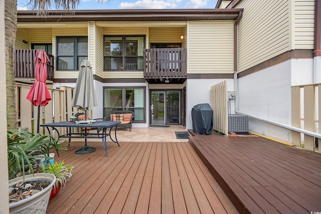 wooden deck with central AC unit
