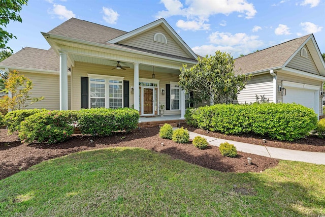 246 Laurel Bay Dr, Murrells Inlet, SC 29576 - view of front of property with covered porch, ceiling fan, roof with shingles, a front yard, and an attached garage