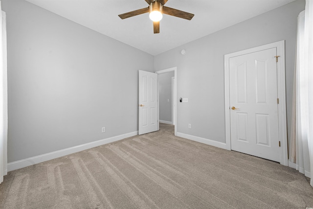 246 Laurel Bay Dr, Murrells Inlet, SC 29576 - unfurnished bedroom with baseboards, light carpet, and ceiling fan