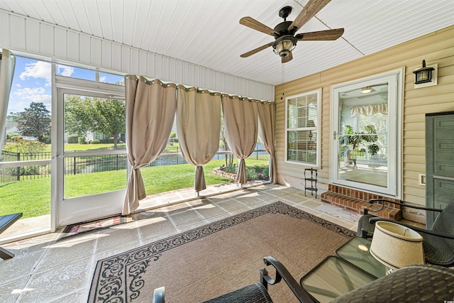 246 Laurel Bay Dr, Murrells Inlet, SC 29576 - sunroom with entry steps, a ceiling fan, a water view, and a healthy amount of sunlight