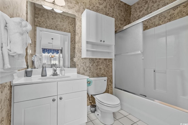 full bath with tile patterned flooring, vanity, toilet, wallpapered walls, and bath / shower combo with glass door
