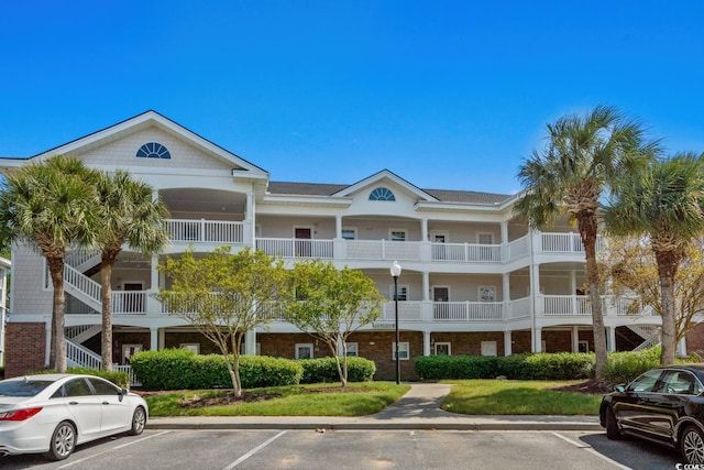 view of property featuring uncovered parking