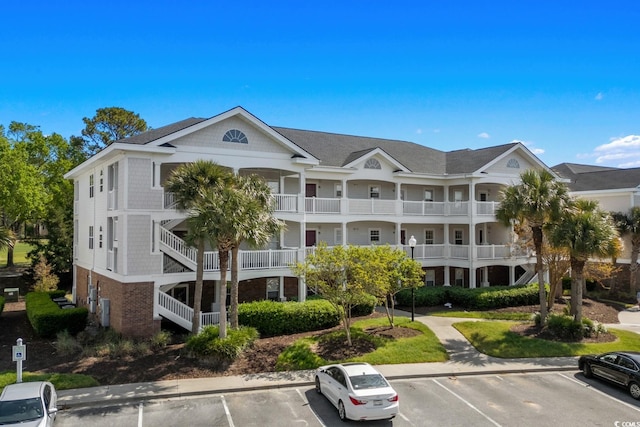 view of property with uncovered parking