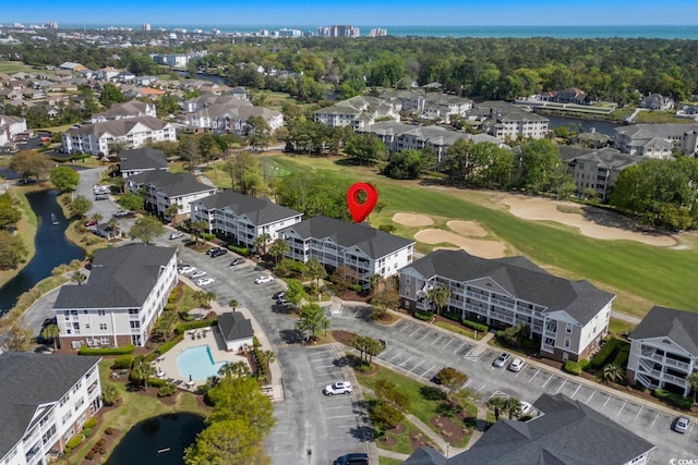 aerial view featuring a water view and golf course view