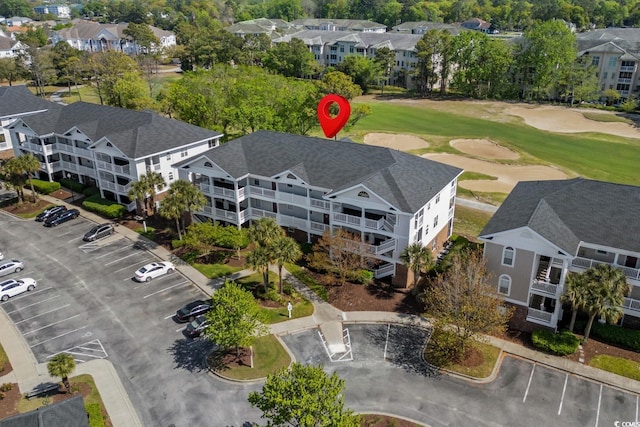 aerial view with a residential view and golf course view