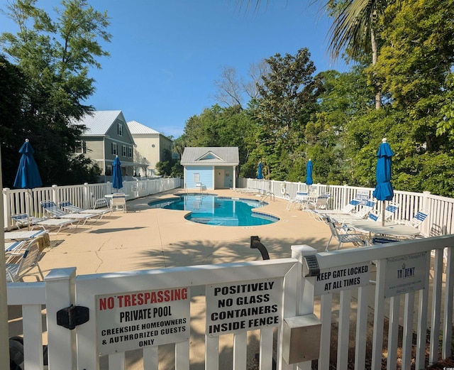 18 Trigger Fish Ln, Murrells Inlet, SC 29576 - community pool with fence and a patio area