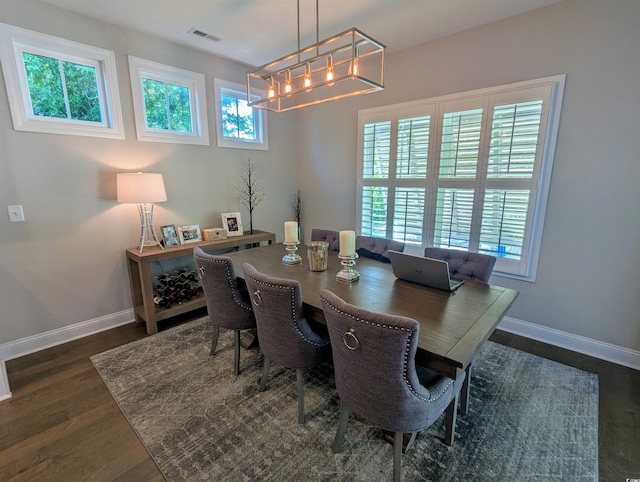 18 Trigger Fish Ln, Murrells Inlet, SC 29576 - dining area with baseboards, a wealth of natural light, a chandelier, and visible vents