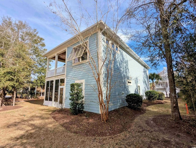 18 Trigger Fish Ln, Murrells Inlet, SC 29576 - view of home's exterior featuring a balcony and a sunroom