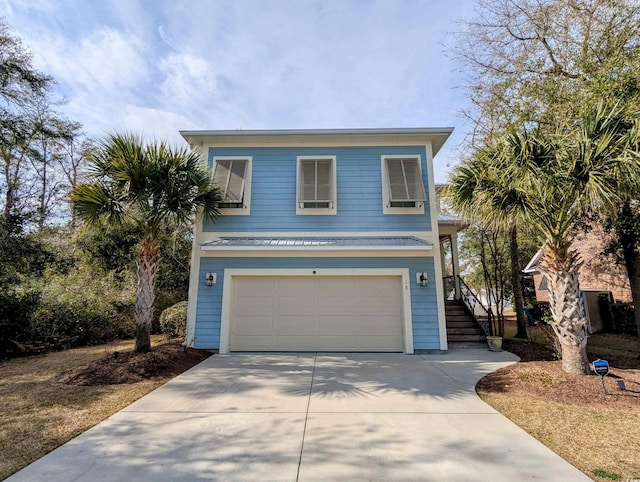 18 Trigger Fish Ln, Murrells Inlet, SC 29576 - view of front of property with concrete driveway, stairs, and a garage