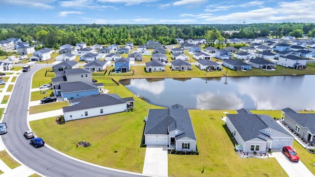 birds eye view of property featuring a water view and a residential view