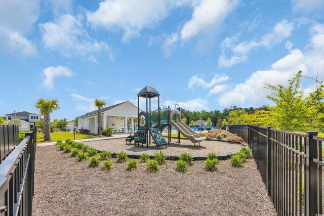 communal playground featuring fence