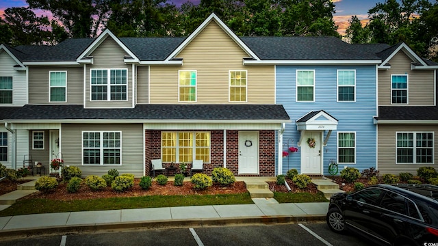 multi unit property featuring uncovered parking