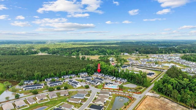 birds eye view of property with a residential view and a view of trees