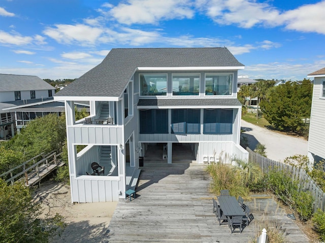 741 Tuckers Rd, Pawleys Island, SC 29585 - rear view of house with roof with shingles, a sunroom, and board and batten siding