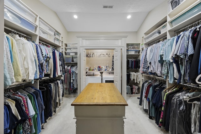 741 Tuckers Rd, Pawleys Island, SC 29585 - walk in closet with washing machine and dryer and light colored carpet