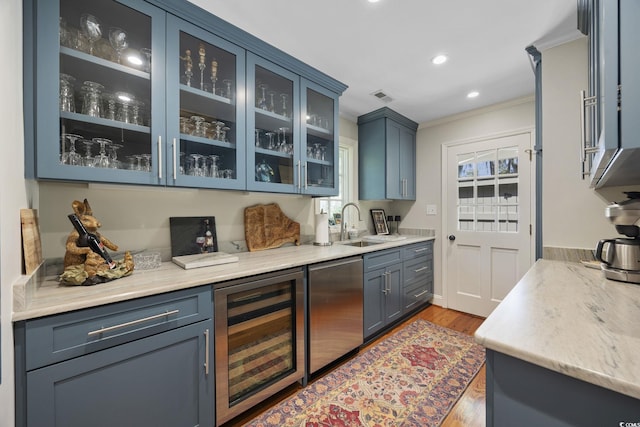 741 Tuckers Rd, Pawleys Island, SC 29585 - bar area with beverage cooler, ornamental molding, plenty of natural light, wood finished floors, and recessed lighting