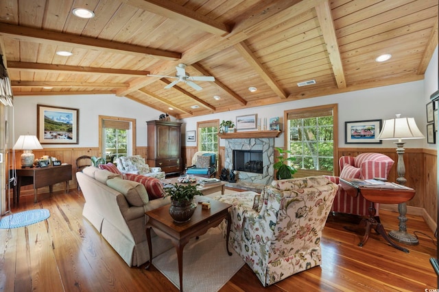 741 Tuckers Rd, Pawleys Island, SC 29585 - living room with wainscoting, hardwood / wood-style floors, wooden ceiling, a fireplace, and plenty of natural light
