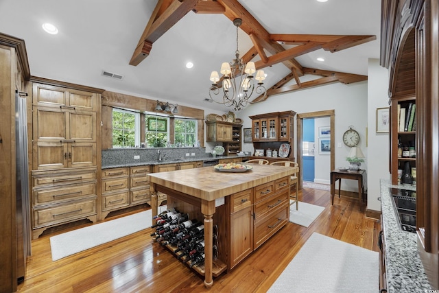 741 Tuckers Rd, Pawleys Island, SC 29585 - kitchen with butcher block countertops, a chandelier, light wood-style floors, pendant lighting, and recessed lighting
