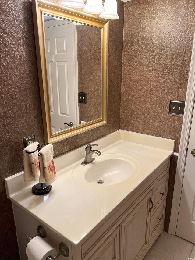 bathroom featuring wallpapered walls, vanity, and tile patterned flooring