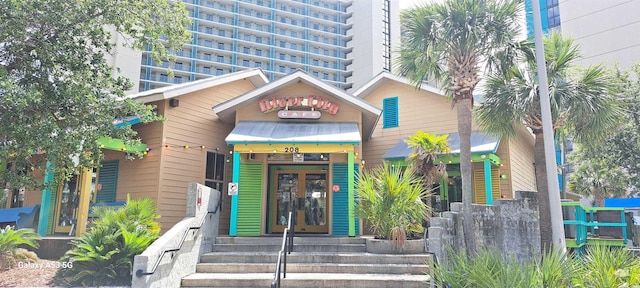 310 N 73rd Ave N Unit 5D, Myrtle Beach, SC 29572 - entrance to property featuring french doors, a standing seam roof, and metal roof
