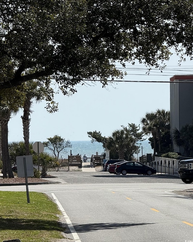 view of asphalt street featuring traffic signs