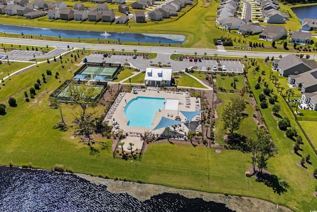drone / aerial view featuring a water view and a residential view