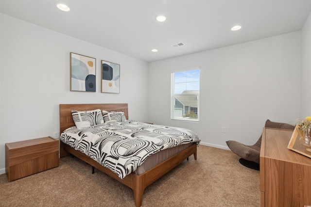 bedroom featuring baseboards, visible vents, recessed lighting, and light colored carpet
