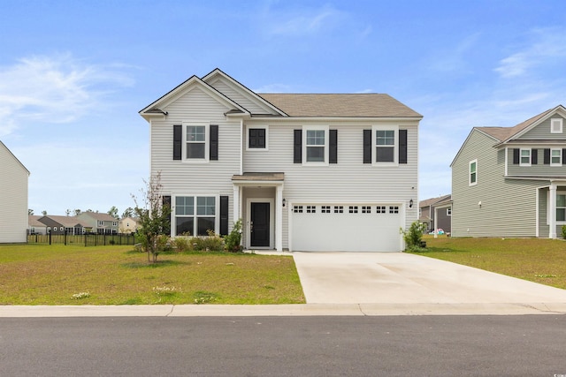 view of front of house with a garage, fence, driveway, and a front yard
