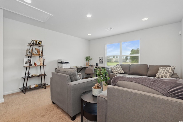 living area with visible vents, light carpet, baseboards, attic access, and recessed lighting