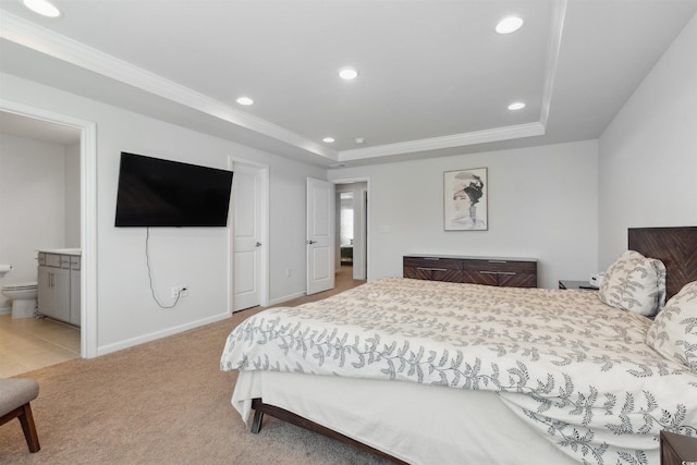 bedroom with crown molding, recessed lighting, and a tray ceiling