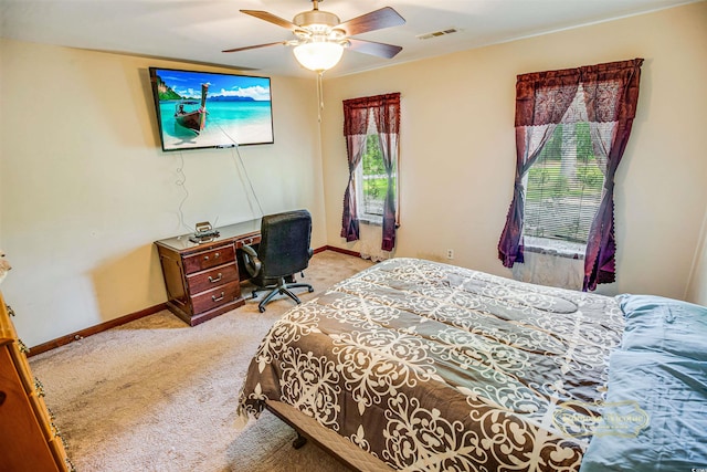 bedroom with visible vents, baseboards, a ceiling fan, and carpet floors