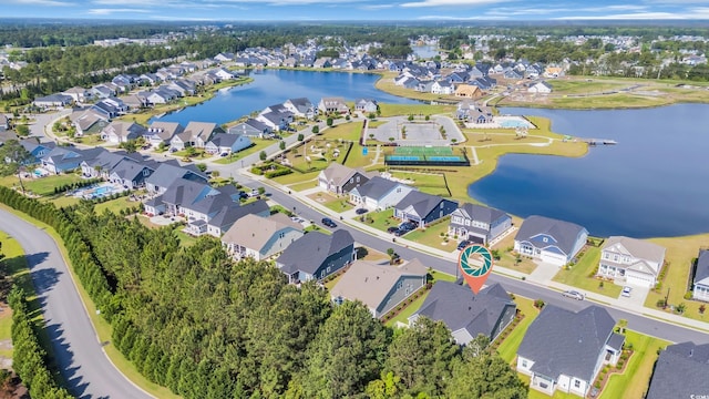 bird's eye view with a water view and a residential view