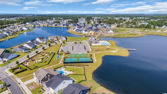 birds eye view of property featuring a water view and a residential view