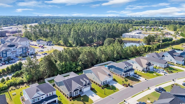 birds eye view of property featuring a residential view and a forest view