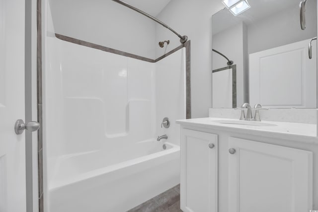 bathroom with vanity, tile patterned flooring, and  shower combination