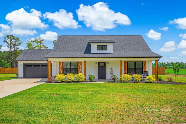 view of front facade featuring a porch, a front yard, concrete driveway, an attached garage, and a shingled roof