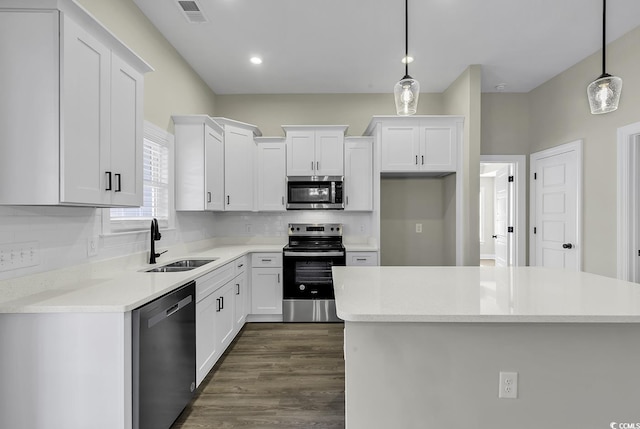 2919 Hughes Gasque Rd, Aynor, SC 29511 - kitchen featuring appliances with stainless steel finishes, a sink, white cabinets, backsplash, and recessed lighting