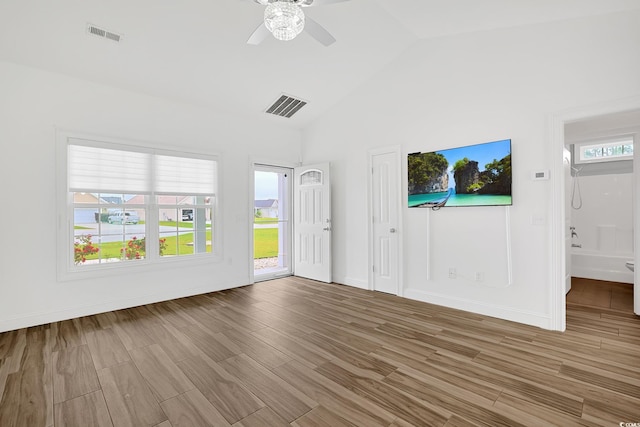 unfurnished living room featuring wood finished floors, ceiling fan, and visible vents