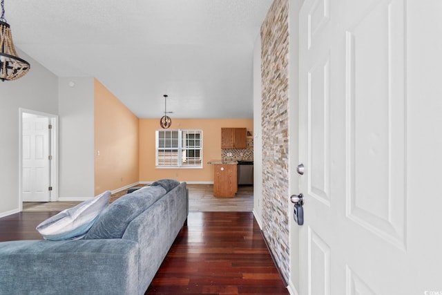 408 Chesterfield Ct, Myrtle Beach, SC 29577 - living room with dark wood-style flooring, baseboards, and vaulted ceiling