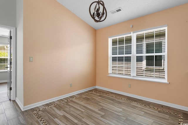 408 Chesterfield Ct, Myrtle Beach, SC 29577 - empty room featuring wood tiled floors, a chandelier, baseboards, and lofted ceiling