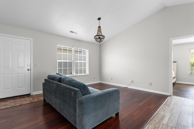 408 Chesterfield Ct, Myrtle Beach, SC 29577 - living area featuring vaulted ceiling, a chandelier, wood finished floors, and baseboards