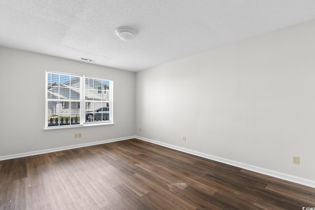 408 Chesterfield Ct, Myrtle Beach, SC 29577 - unfurnished room featuring dark wood-type flooring, a textured ceiling, and baseboards