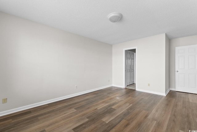 408 Chesterfield Ct, Myrtle Beach, SC 29577 - unfurnished bedroom with wood finished floors, baseboards, and a textured ceiling